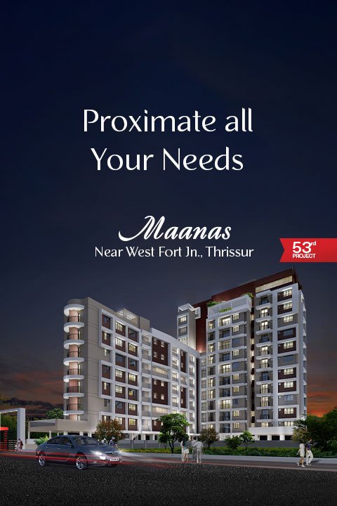 Exterior view of TBPL Maanas flats in Thrissur with modern architecture and lush surroundings